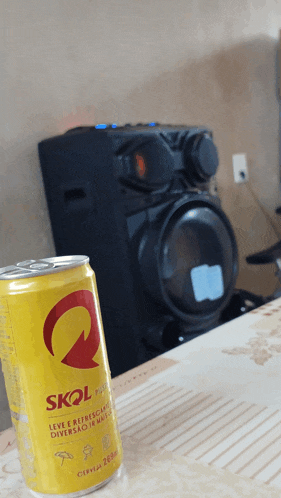 a can of skol beer sits on a table