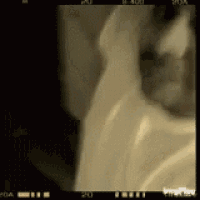 a close up of a person 's face with the number 20 on the bottom left