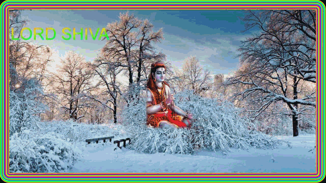 a statue of lord shiva is sitting in a snowy forest
