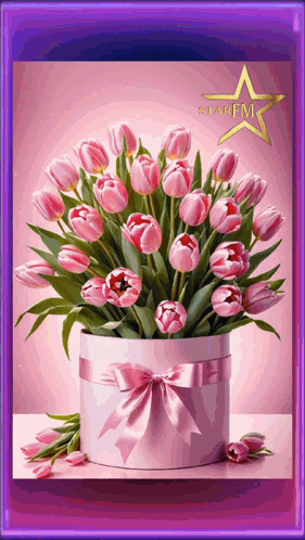 a bouquet of pink flowers in a pink box with a star fm logo