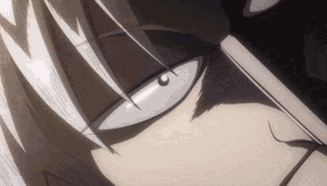a close up of a person 's face with white eyes and a sword in his hand .