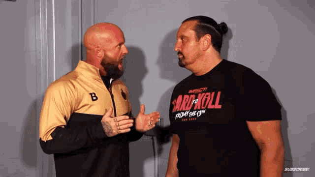 two men are standing next to each other and one is wearing a shirt that says " card roll "