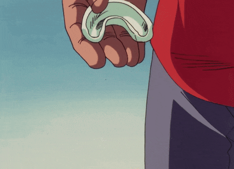 a person holding a green object in their hand