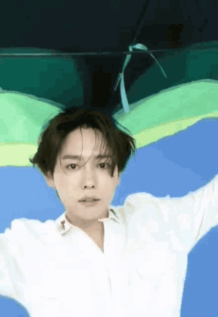a man in a white shirt is floating in the air
