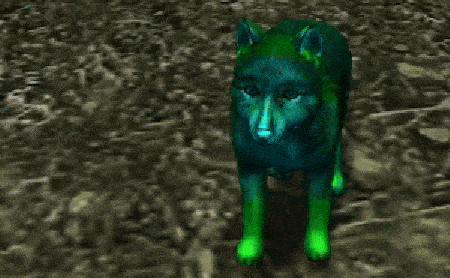a green wolf is standing in the dirt