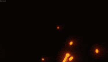 a close up of a person 's face with a flame coming out of it .