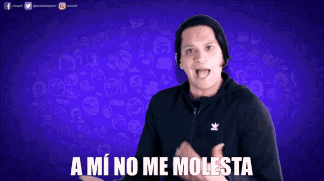 a man wearing a black adidas jacket stands in front of a purple background