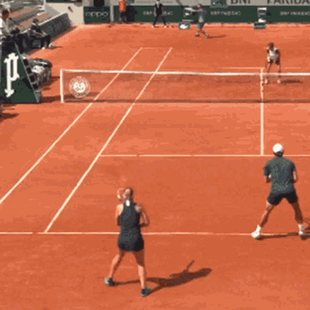 a tennis court with an oppo banner on the side