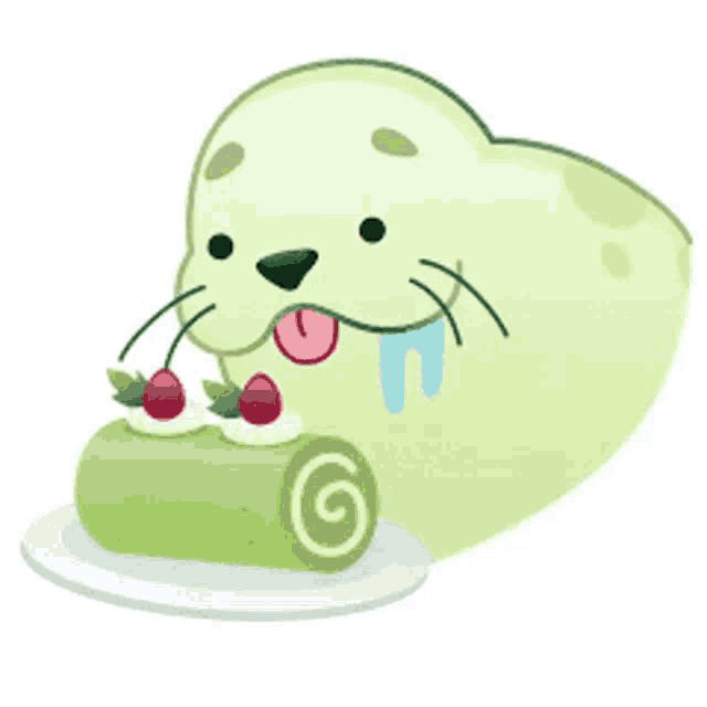 a seal is eating a green cake with strawberries on top