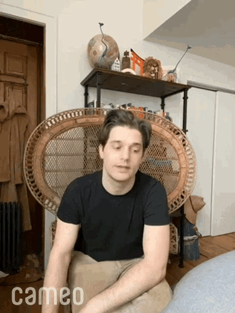 a man sits in a wicker chair with cameo written on the bottom of the image
