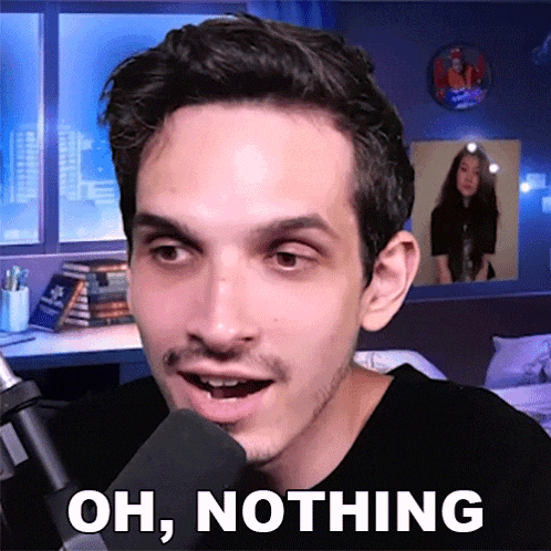 a man talking into a microphone with the words oh nothing behind him