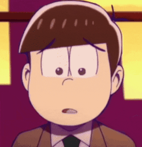 a close up of a cartoon character wearing a suit and tie with a sad look on his face .