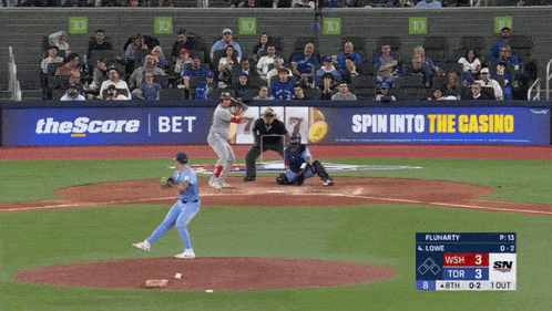 a baseball game is being played in front of an ad for the score bet