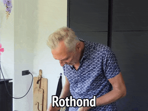 a man in a blue shirt with the word rothond written on his shirt