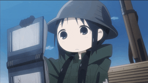 a girl wearing a helmet is holding a book in her hand