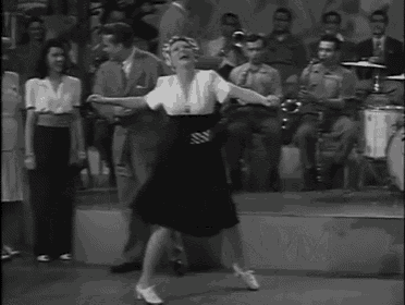 a woman dancing in front of a drum that says td