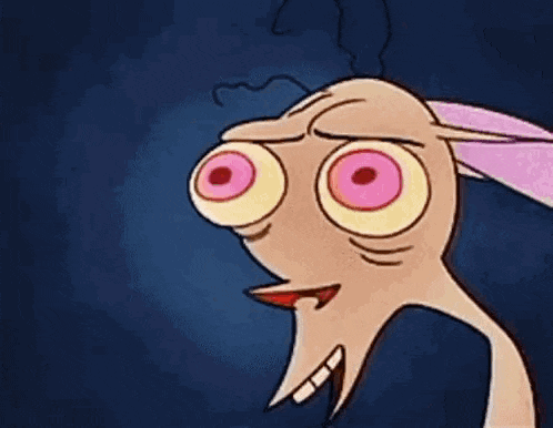 a close up of a cartoon character with big eyes and a very angry face .