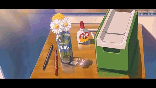 a bottle of glue sits next to a vase of daisies
