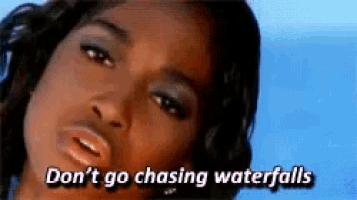 a close up of a woman 's face with the words `` don 't go chasing waterfalls '' written above her .