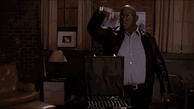 a man standing in a living room with the words blessin 's rainin ' down on you