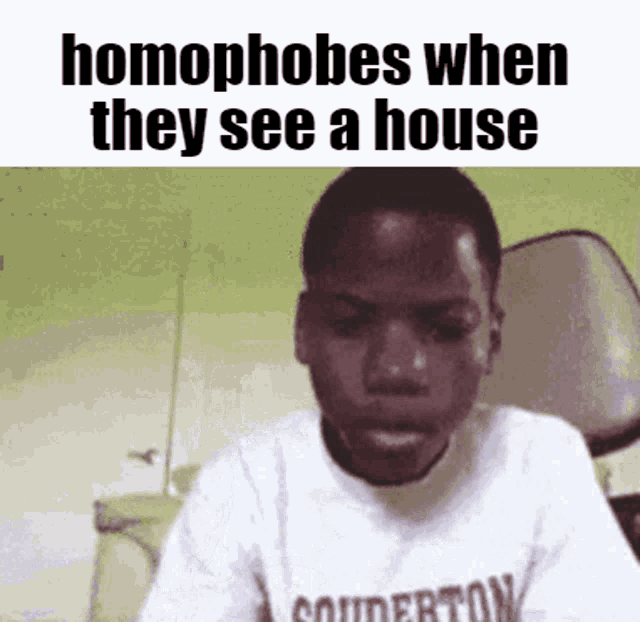 a young boy is wearing a shirt that says souderton on it .