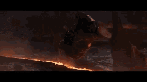 thor is hanging upside down in chains in a movie scene .