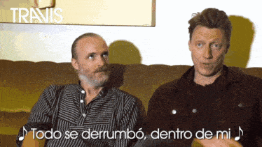 two men are sitting on a couch and the words todo se derrumbo dentro de mi are above them