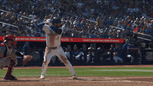 rogers is one of the advertisers on the wall behind the batter