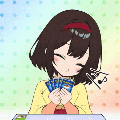a girl is holding a stack of pokemon cards