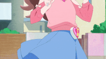 a girl in a pink sweater and blue skirt has a heart shaped belt around her waist