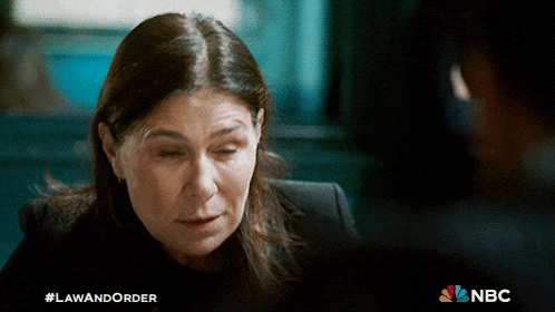 a nbc ad for law and order shows a woman looking down