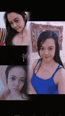a woman in a blue tank top takes a selfie in front of a framed picture