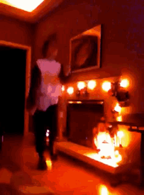 a blurry photo of a person dancing in a living room