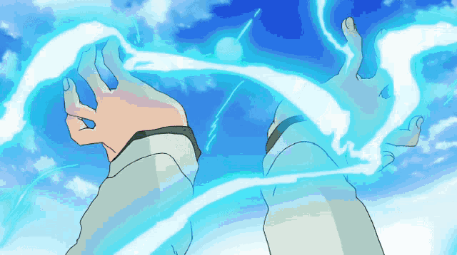 a person 's hands are shown with a blue light coming out of them