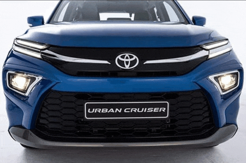 the front of a blue toyota urban cruiser car