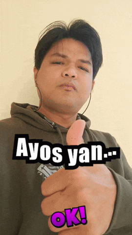 a man wearing headphones giving a thumbs up with the words ayos yan ok