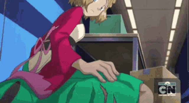 a cartoon character is sitting on a box with cn on the bottom
