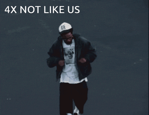 a man wearing a white hat and a black jacket with the words " 4x not like us " below him