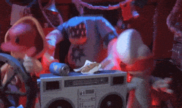 a cartoon character is standing next to a boombox that says boombox