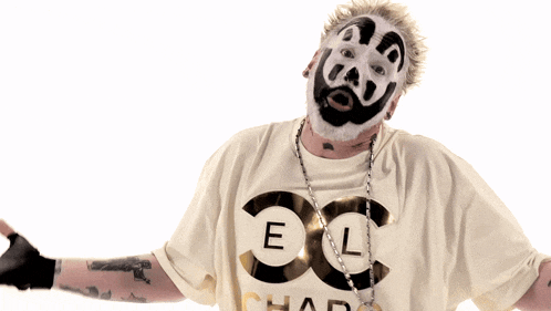 a man wearing a chanel t-shirt and a black and white mask