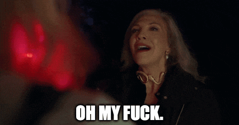 a woman in a black jacket is smiling and says `` oh my fuck '' .