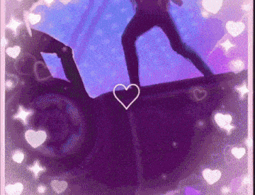 a man standing on top of a purple car with a heart in the middle .