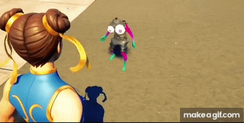 a cartoon character is standing next to a cartoon character with big eyes .