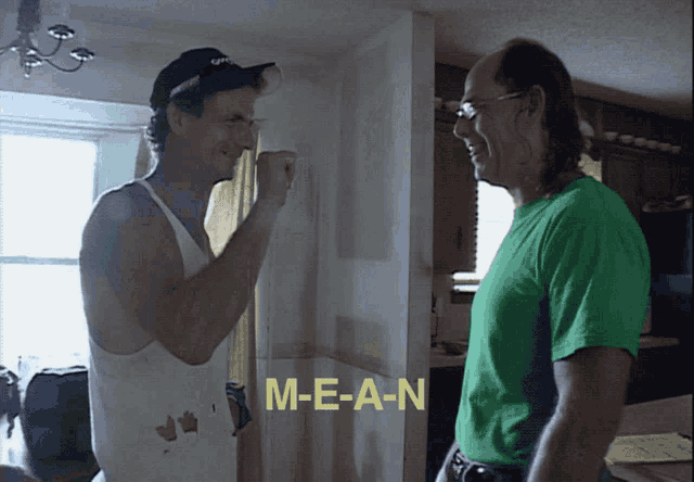 two men are standing next to each other with the words m-e-a-n visible