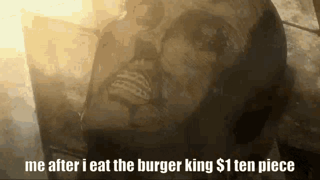 a statue of a man with the words `` me after i eat the burger king $ 1 ten piece ''