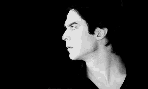 a close up of a man 's face in a black and white photo .