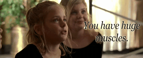 two young girls are standing next to each other with the words " you have huge muscles " on the bottom