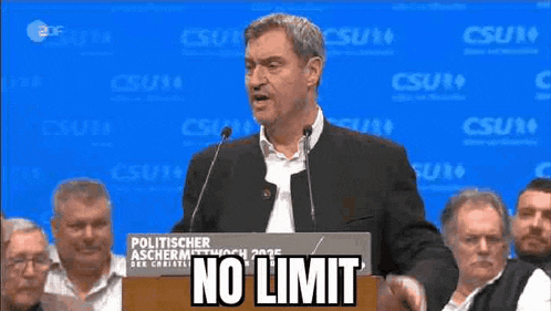 a man is giving a speech at a podium that says no limit