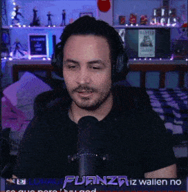 a man wearing headphones is talking into a microphone with the words fuanza iz wallen no on the bottom