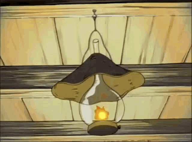 a cartoon drawing of a lantern with a flame coming out of it hanging from the ceiling .